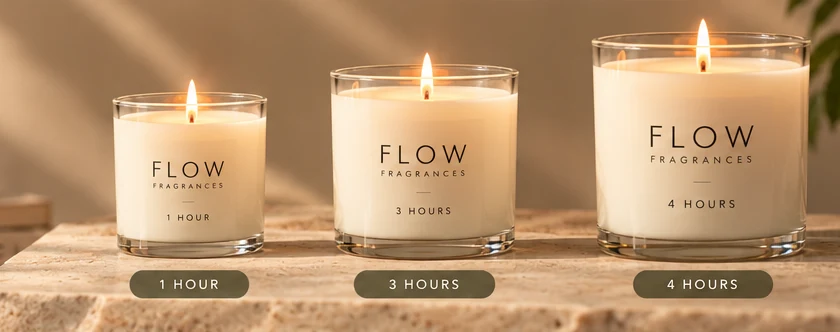 Three FLOW candles in 1, 3 and 4 hour sizes on a stone surface.